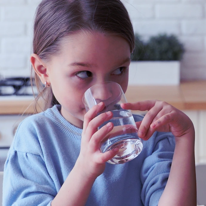 Girl drinking water safely