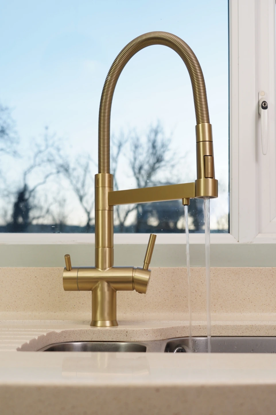 gold rio 3 way kitchen tap turned on